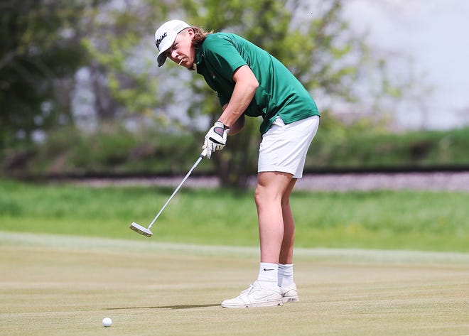 Boone's Wyatt Anderson looks at the ball after a putt onto the 2nd hole in the Raccoon River Conference boys golf tournament on Monday, May 8, 2023, at Ames Golf and Country Club.