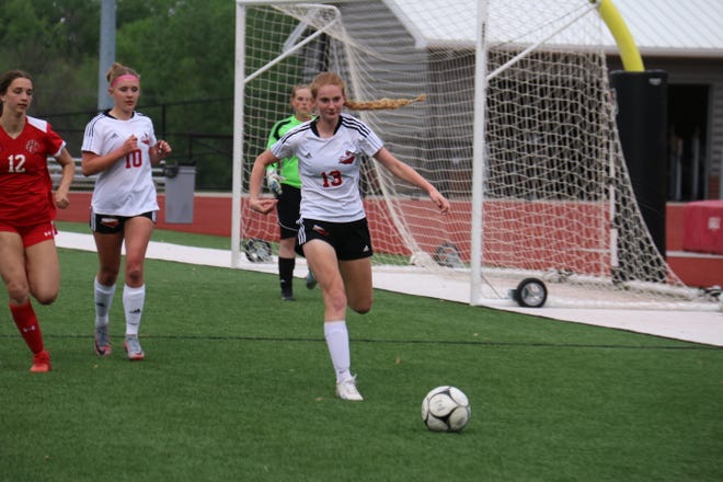 Boone's Mariah Bolton chases down the ball during a game against ADM on Monday, May 15, 2023, in Adel.